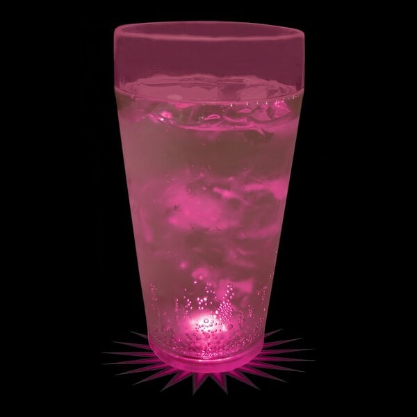 A 20 oz. plastic cup with pink liquid and a pink LED light inside.