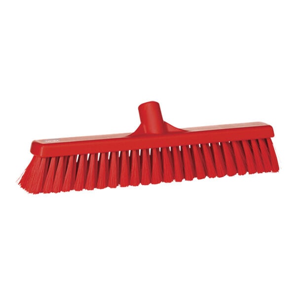 A red Vikan push broom head with long bristles.