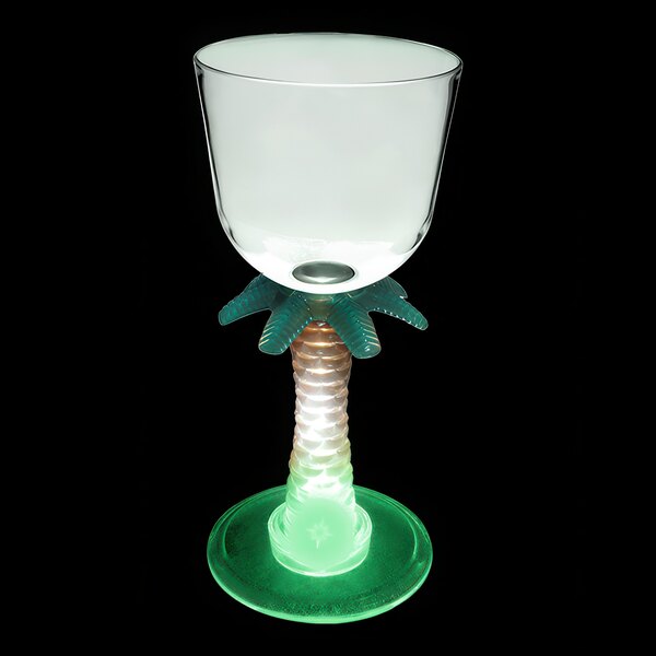 A clear plastic wine cup with a palm tree stem and a green LED light.