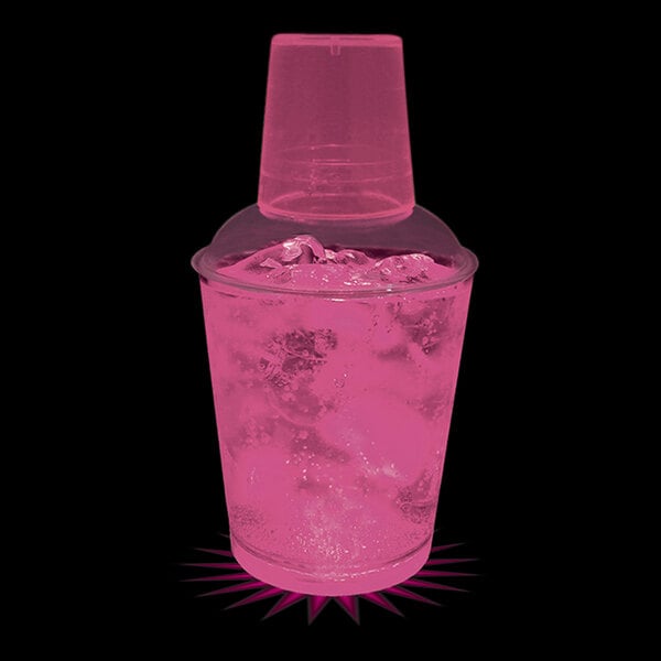A pink plastic shaker with a pink drink inside.