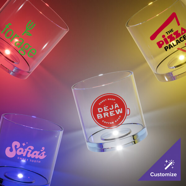 A close-up of a 6 oz. plastic rocks cup with a red LED light and a logo on it.