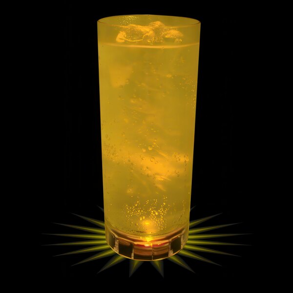 A close up of a 14 oz. plastic cup of yellow liquid with ice and a yellow LED light shining on it.