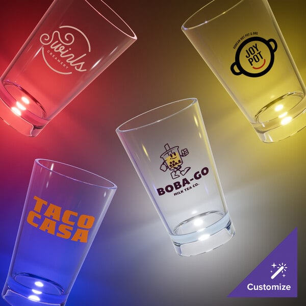 A group of customizable plastic shot cups with red LED lights.