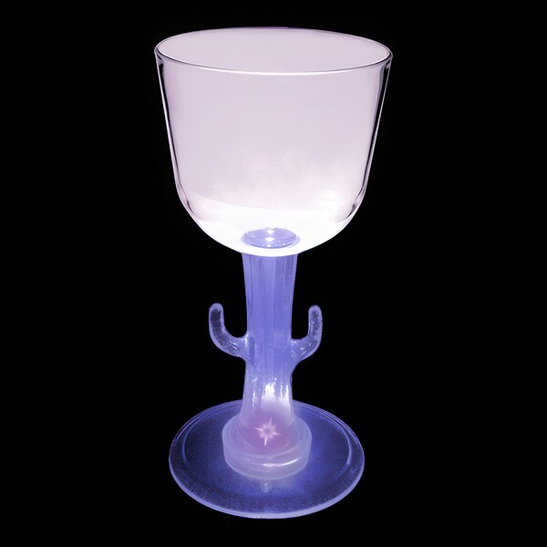 A customizable plastic wine cup with a cactus shaped stem and purple LED light on a table.