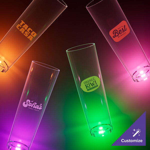 A group of empty Customizable plastic glasses with colorful LED lights.