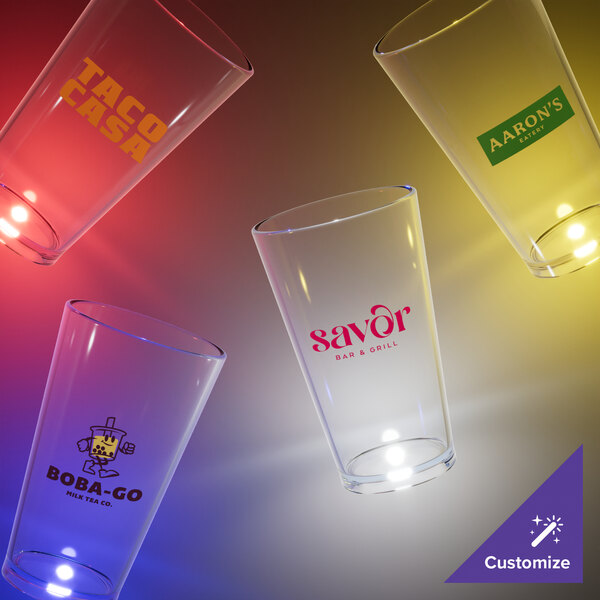 A close-up of a customizable clear plastic pint cup with a yellow LED light.