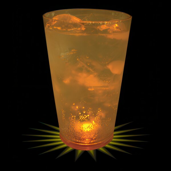 A customizable plastic pint cup with a yellow LED light inside filled with a yellow liquid with ice.