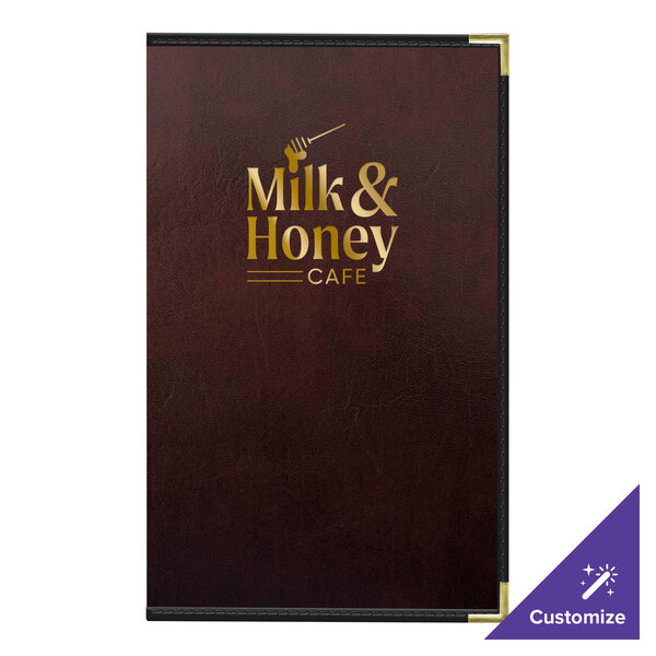 A brown leather H. Risch, Inc. menu cover with gold text on it on a table in a family-style restaurant.