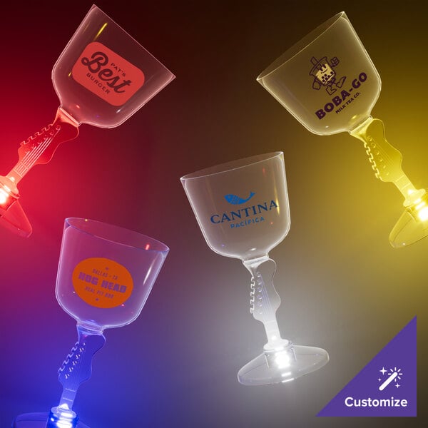 A group of customizable plastic guitar stem wine glasses with yellow LED lights.