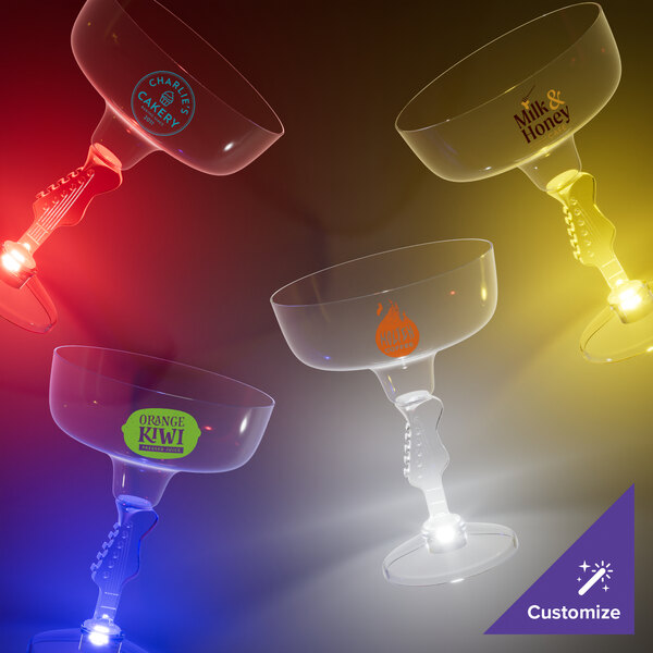A close-up of a clear plastic guitar stem margarita cup with a blue LED light.