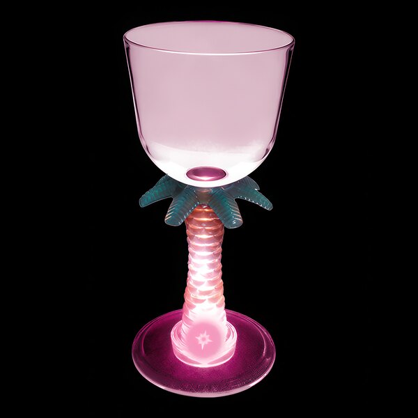 A clear plastic wine cup with a pink palm tree stem and a pink LED light inside.