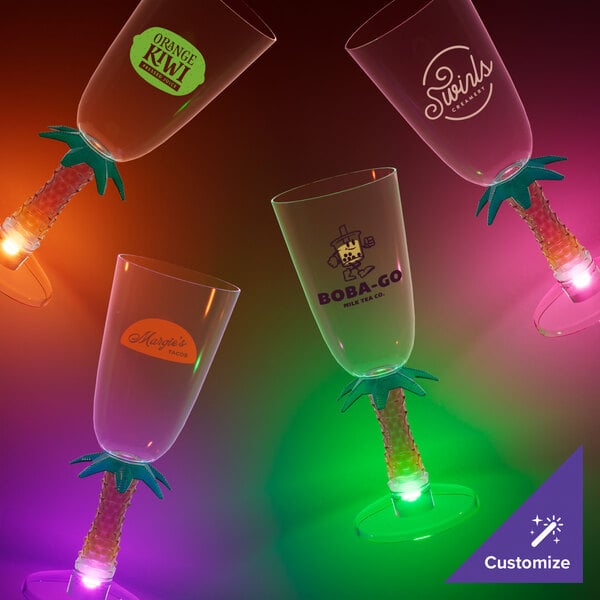 A customizable plastic champagne glass with a palm tree stem and purple LED light.