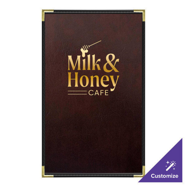 A brown leather H. Risch, Inc. menu cover with a milk & honey cafe logo and interior pocket on a table with a menu with gold text.