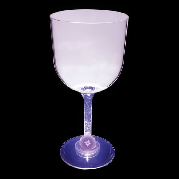 A clear plastic goblet with a purple stem and blue base.