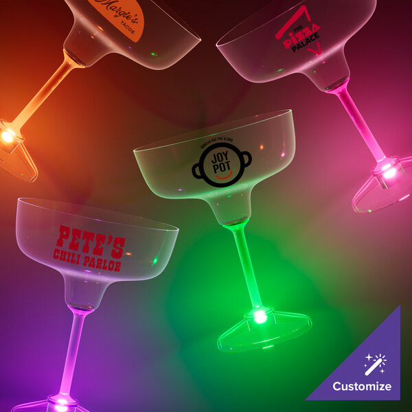 A close-up of a customizable plastic margarita glass with a purple LED light.