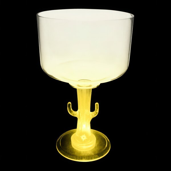 A clear plastic cactus stem margarita cup with a yellow light on it.