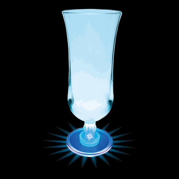 A clear plastic hurricane cup with a blue light on top.