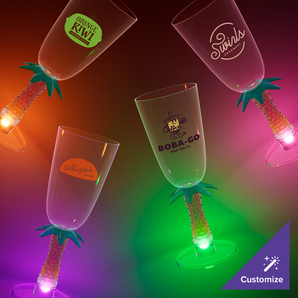 A customizable plastic champagne glass with a palm tree stem and a pink LED light.