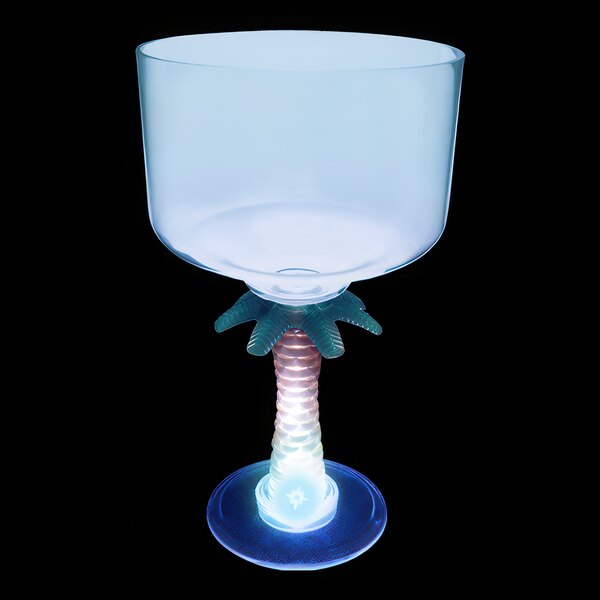 A clear plastic palm tree stem margarita cup with a blue LED light on it.