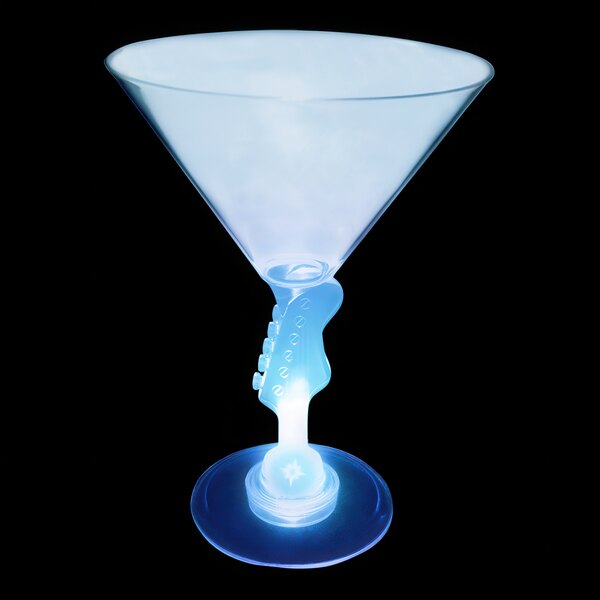 A clear plastic martini glass with a blue light up guitar stem.