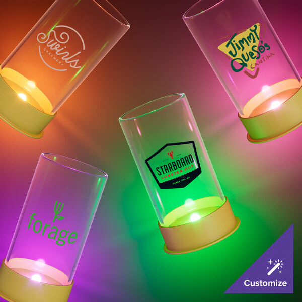 A group of customizable plastic shotgun shell shot cups with purple LED lights.