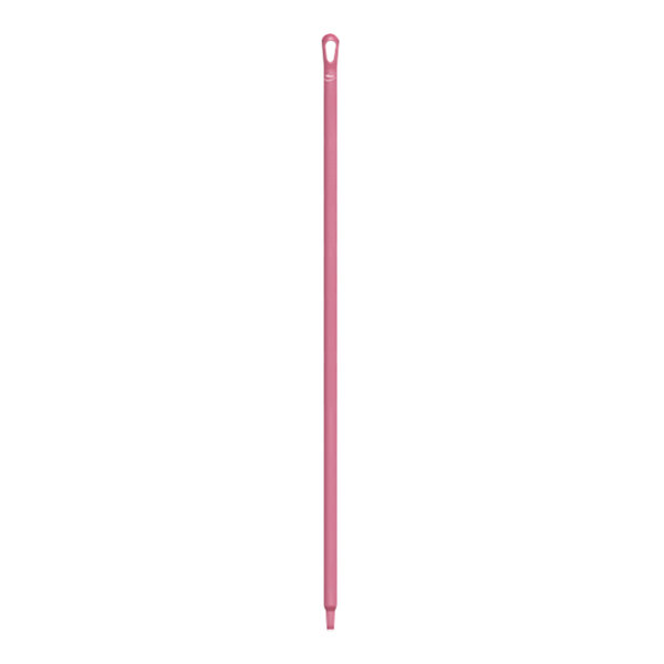 A pink plastic stick with a hole in the end.