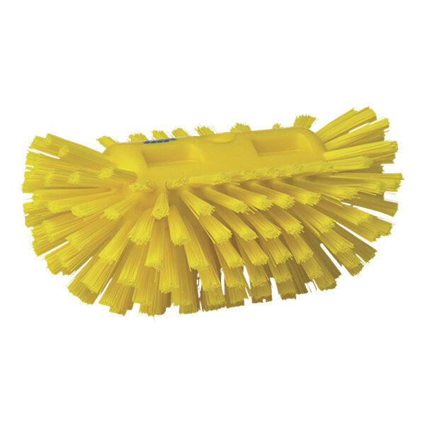 A close-up of a Vikan yellow tank brush head with stiff bristles.