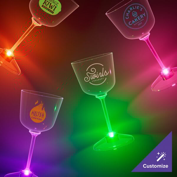 A room with a group of customizable plastic wine glasses with purple LED lights.