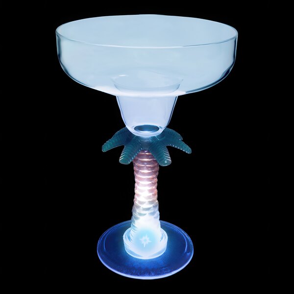 A clear plastic margarita glass with a palm tree stem and a blue LED light.