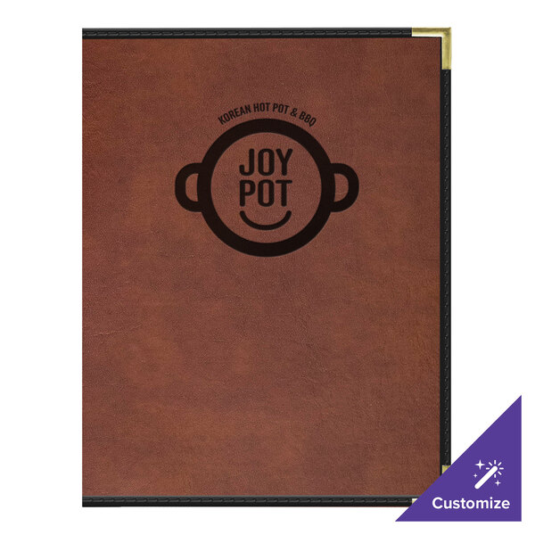 A brown leather H. Risch, Inc. menu cover on a table.