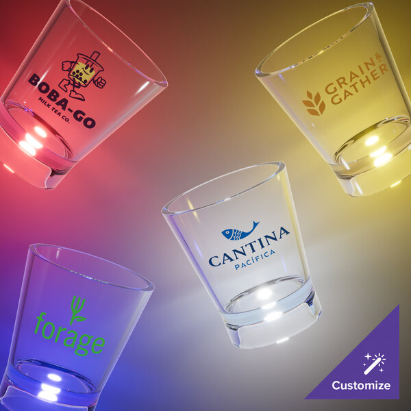 A customizable plastic shot cup with a yellow LED light.