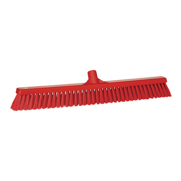 A red Vikan push broom head with long bristles.