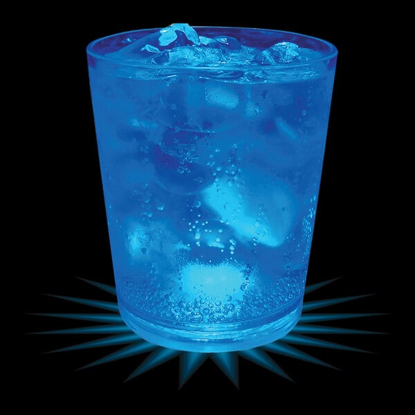 A 12 oz plastic rocks cup with blue liquid and ice cubes with a blue LED light.