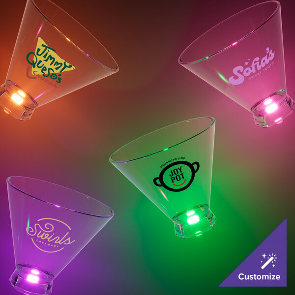 A group of customizable plastic stemless martini cups with different colored LED lights.