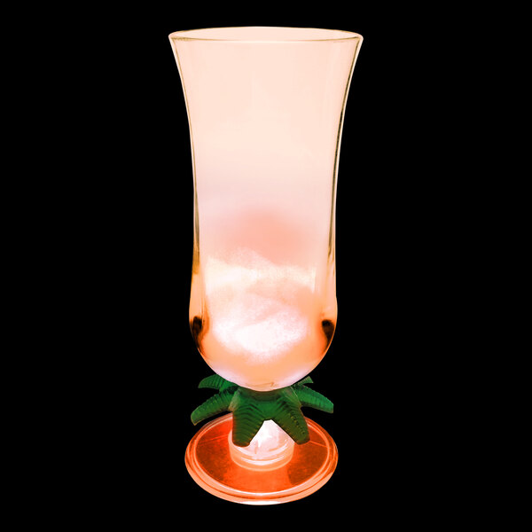 A customizable plastic hurricane cup with a palm tree and orange LED light on a white background.