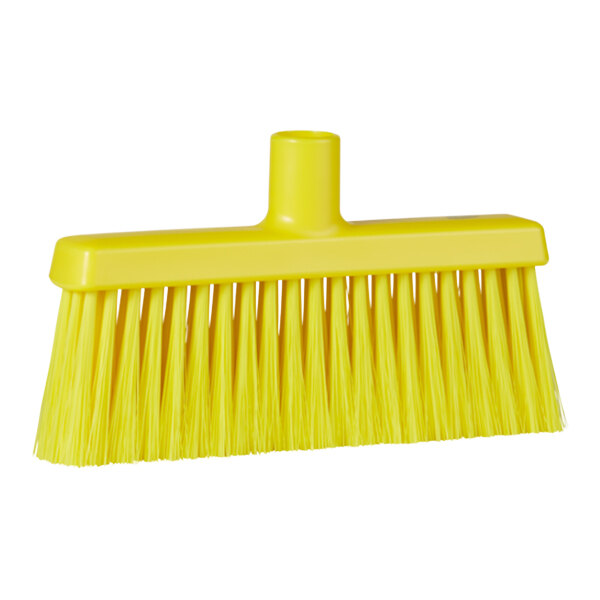 A yellow Vikan lobby broom head with long bristles.