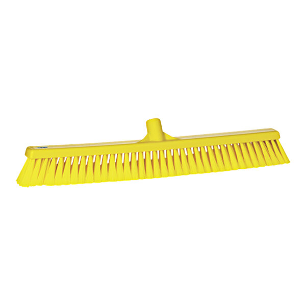 A yellow Vikan push broom head with long bristles.