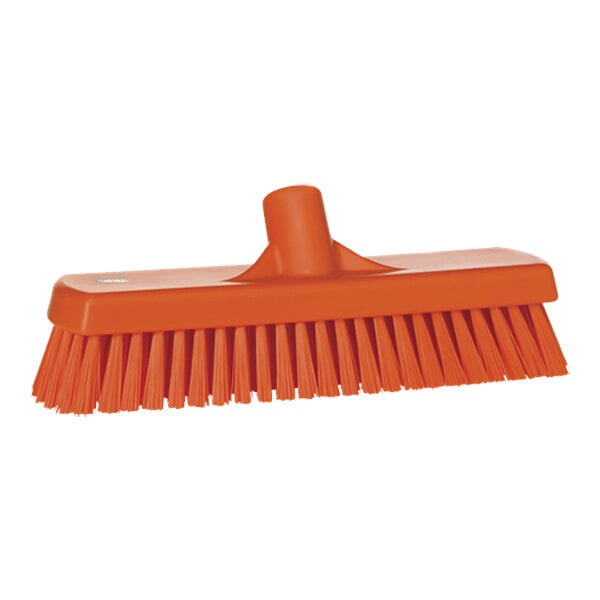 A close-up of an orange Vikan 70607 Wall / Floor Scrub Head with stiff bristles.