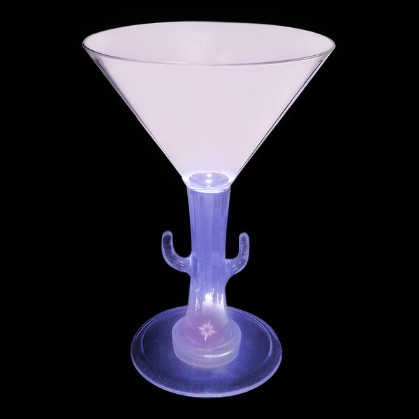 A white plastic martini glass with a cactus shaped stem with a purple LED light.