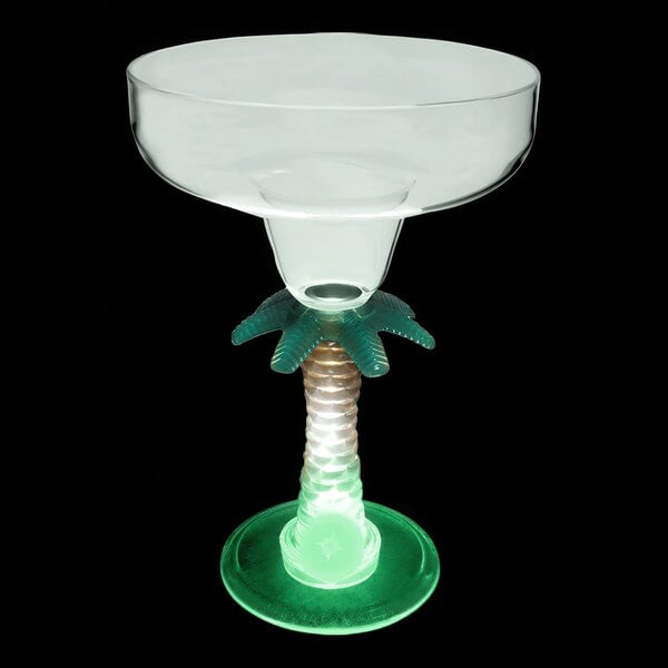 A clear plastic margarita cup with a palm tree stem and green LED light.