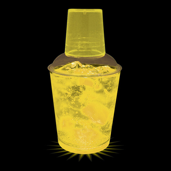 A yellow plastic customizable shaker with a yellow drink inside.