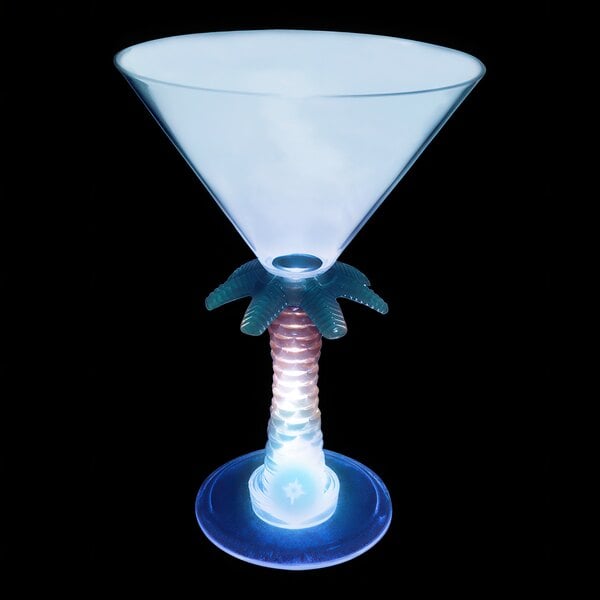 A clear plastic martini glass with a palm tree stem and a blue LED light.