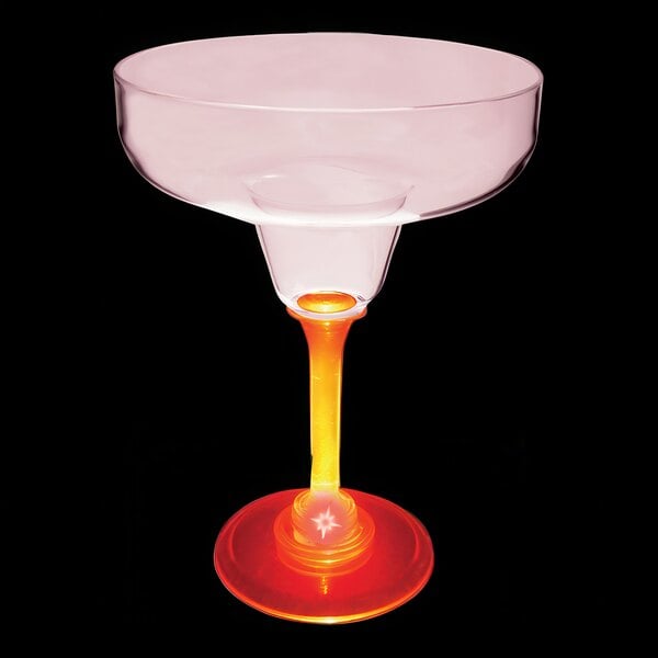 A close up of a 12 oz. plastic margarita glass with a yellow base and red LED light.