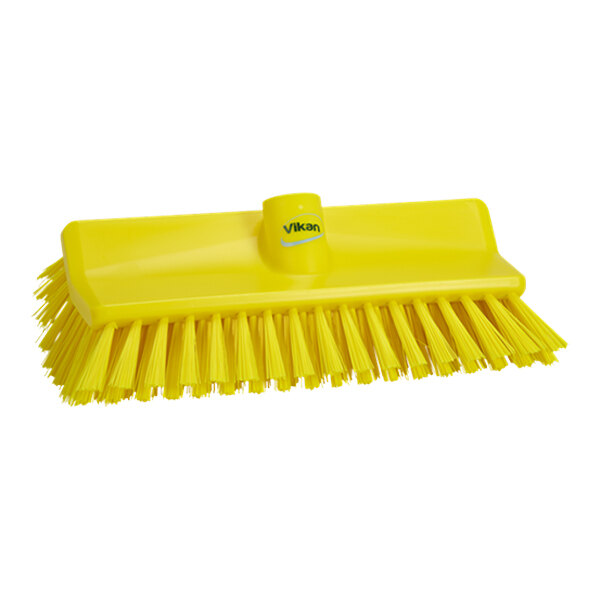 A yellow Vikan deck brush head with medium stiff bristles.