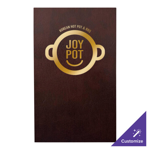 A brown leather H. Risch, Inc. Wine Tuxedo menu cover with picture corners on a table with a brown and gold menu and a restaurant logo.