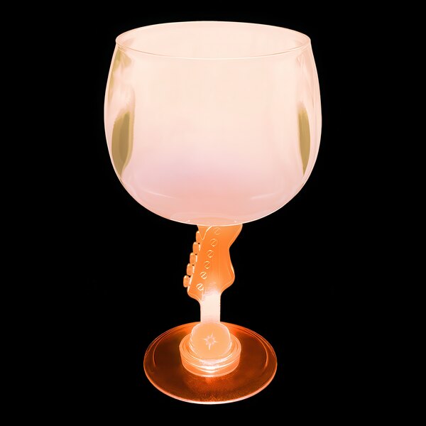 A close-up of a customizable plastic guitar stem goblet with an orange base and pink top with an orange LED light.