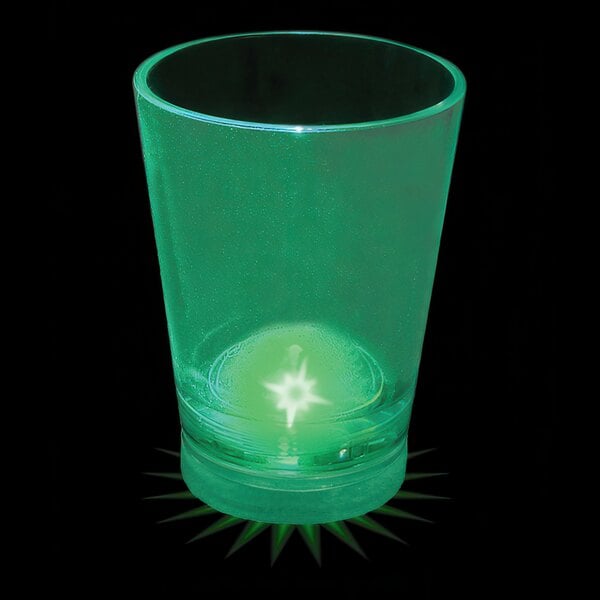 A green plastic shot cup with a light in it.