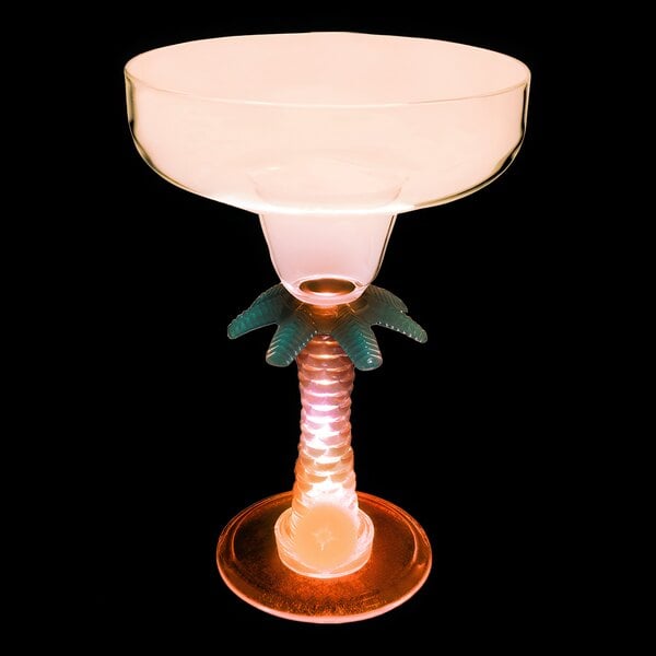 A customizable plastic margarita glass with a palm tree design and an orange LED light.