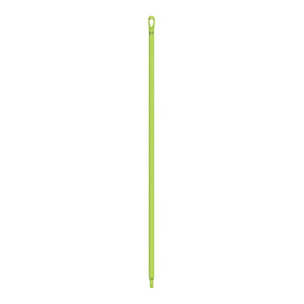 A green plastic stick with a hole in the end.