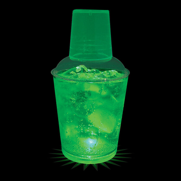A 12 oz. plastic cup with a green LED light filled with a green drink.